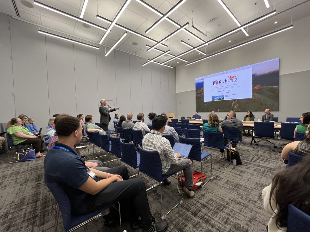 Attendee asks a question during a TechExpo presentation